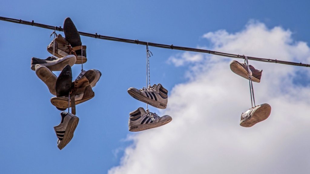 Shoes hanging on wire