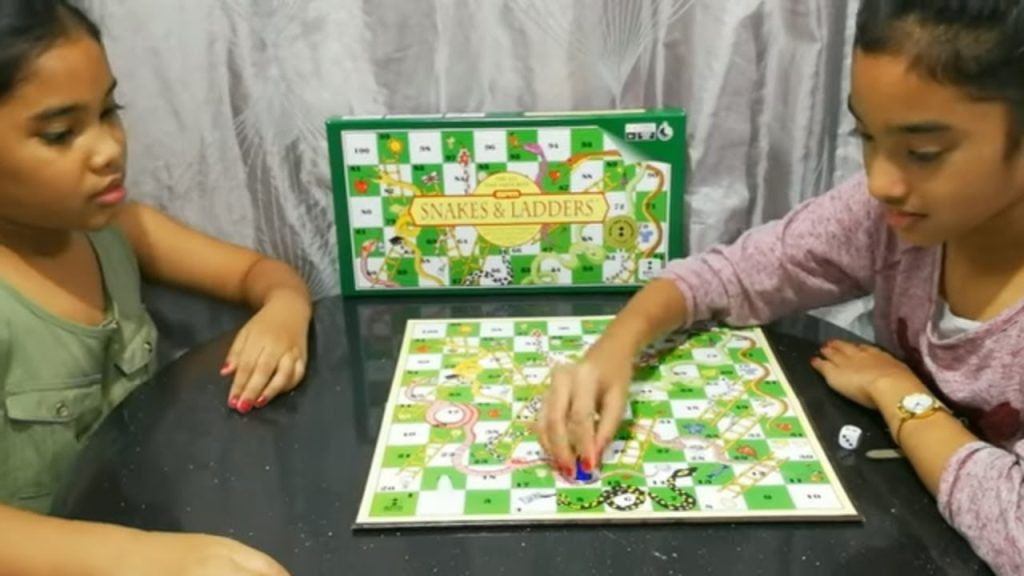 Snakes and Ladders playing girls indian