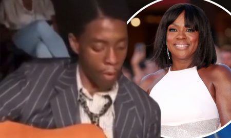 Chadwick Boseman playing guitar