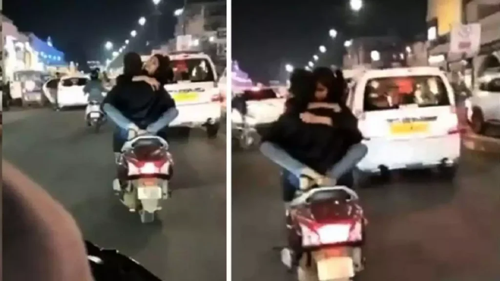 Couple getting viral ,seen romancing while riding a scooty in Lucknow lucknow couple romance on scooty