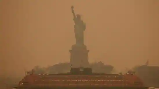 New York City enveloped in smoky haze; wildfire rises in Canada